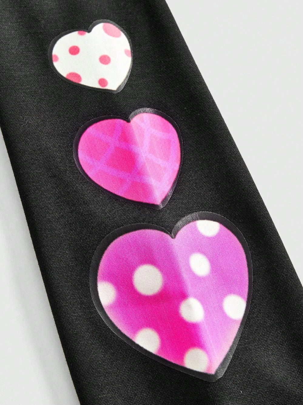 Unisex Black Hoodie with Pink Cartoon Print and Hearts